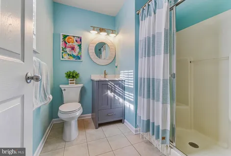 a bathroom with a toilet and a sink