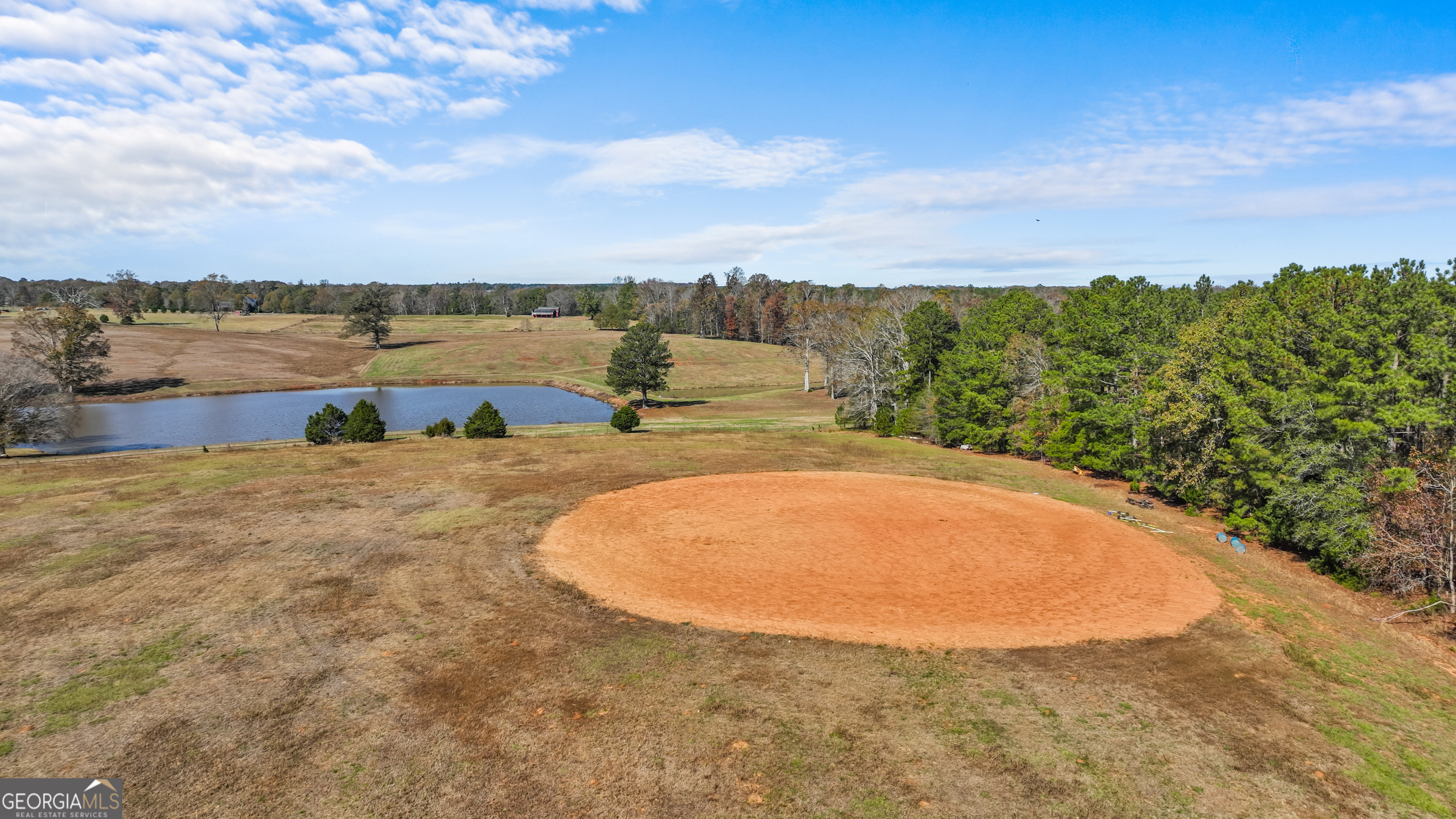1390 Walker Road Madison, GA 30650 - Photo 25 of 64 a view of a lake with a house in the background
