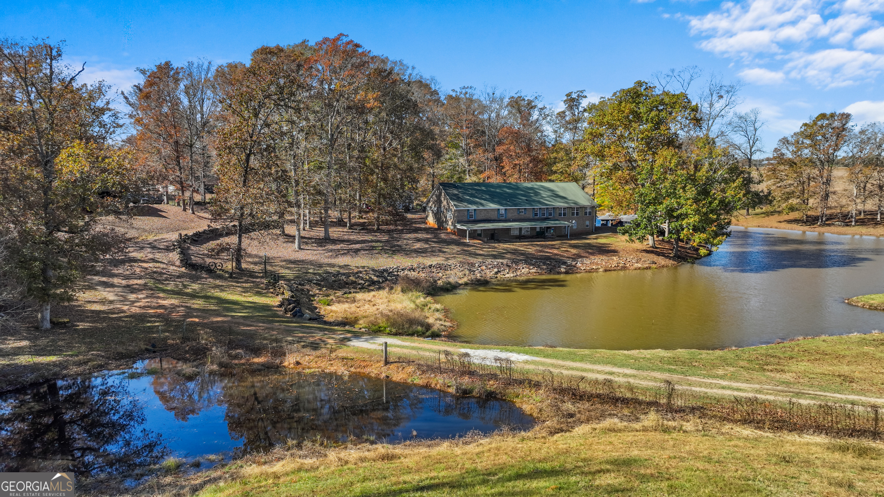 1390 Walker Road Madison, GA 30650 - Photo 29 of 64 a view of a lake with houses