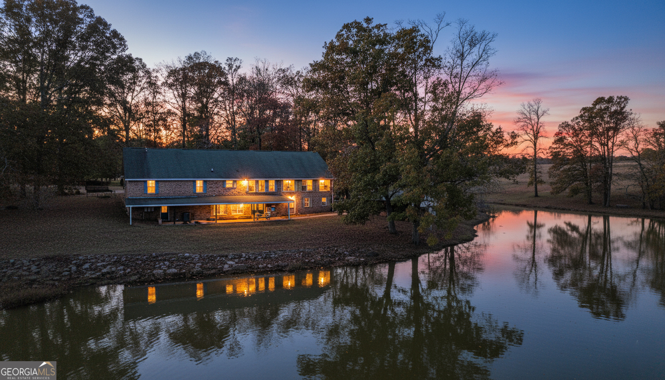 1390 Walker Road Madison, GA 30650 - Photo 49 of 64 a view of a lake from a yard