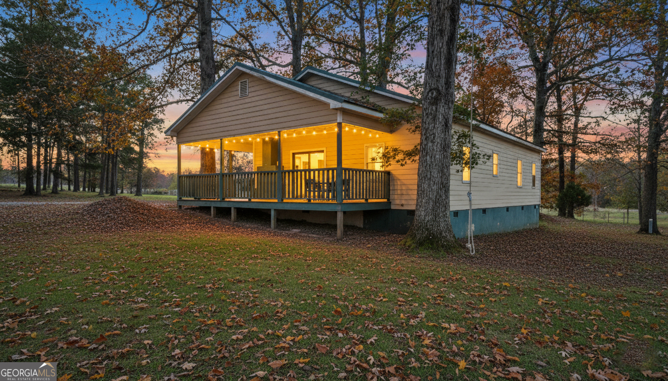1390 Walker Road Madison, GA 30650 - Photo 56 of 64 a backyard of a house with barbeque oven table and chairs