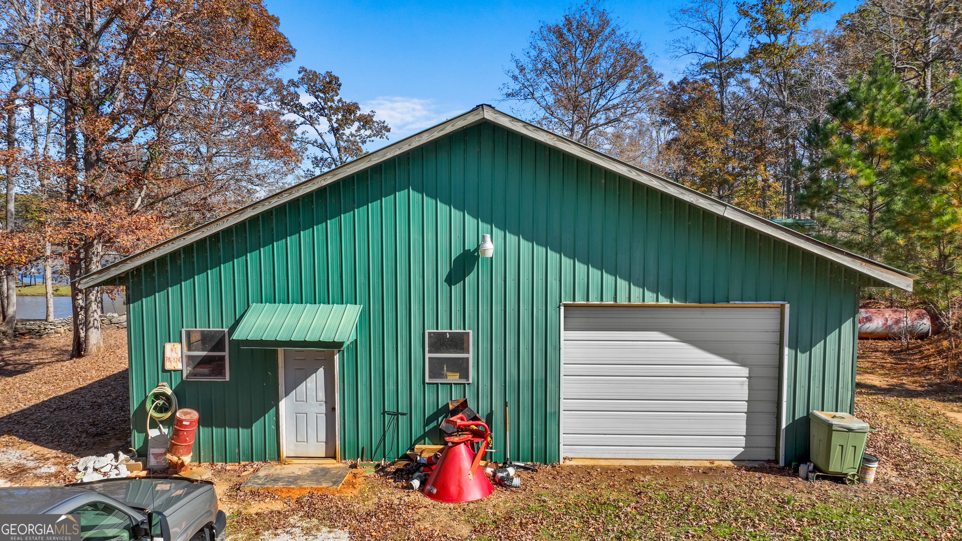 1390 Walker Road Madison, GA 30650 - Photo 61 of 64 a front view of a house with garage