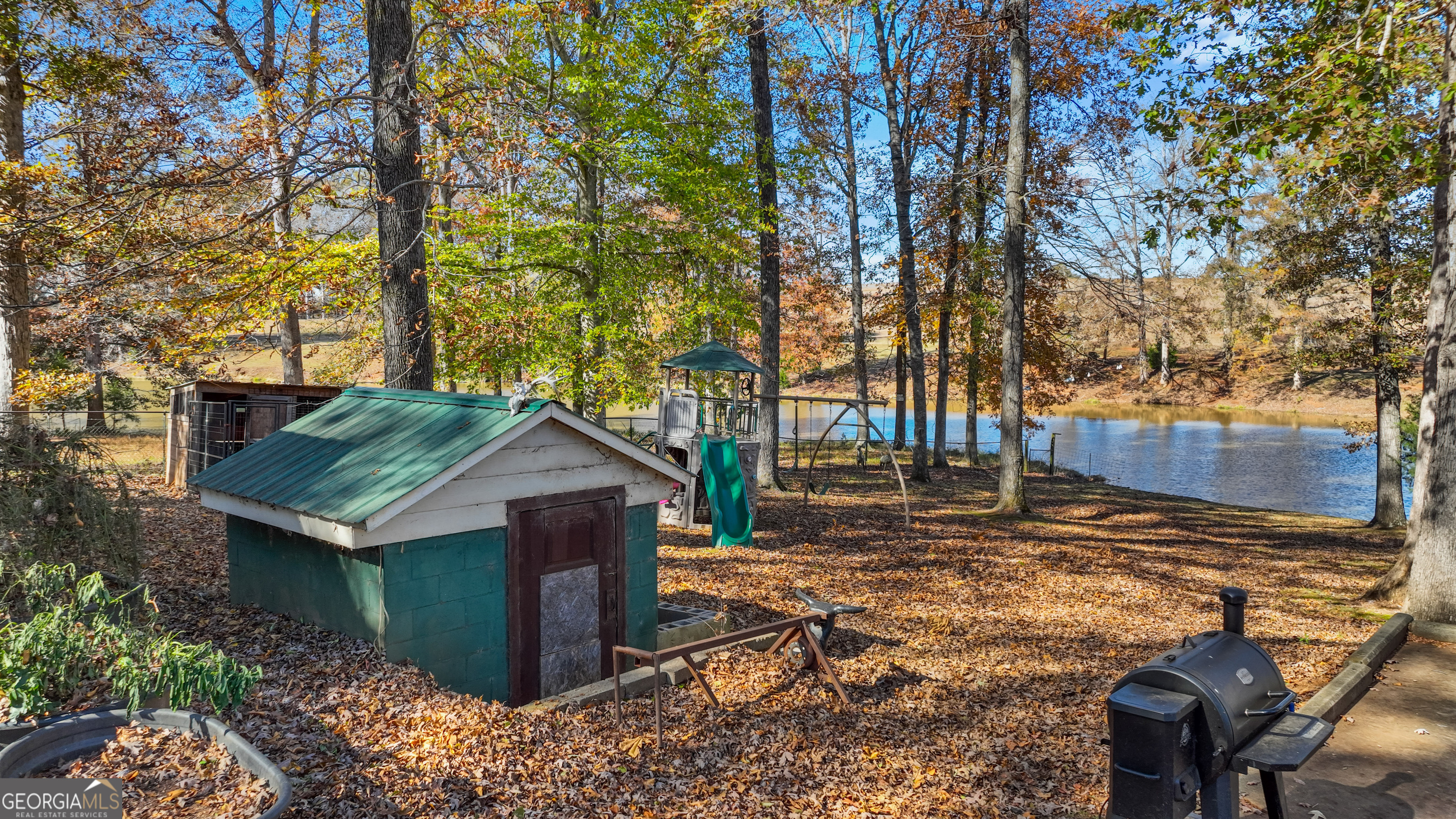 1390 Walker Road Madison, GA 30650 - Photo 63 of 64 a house view with a backyard space