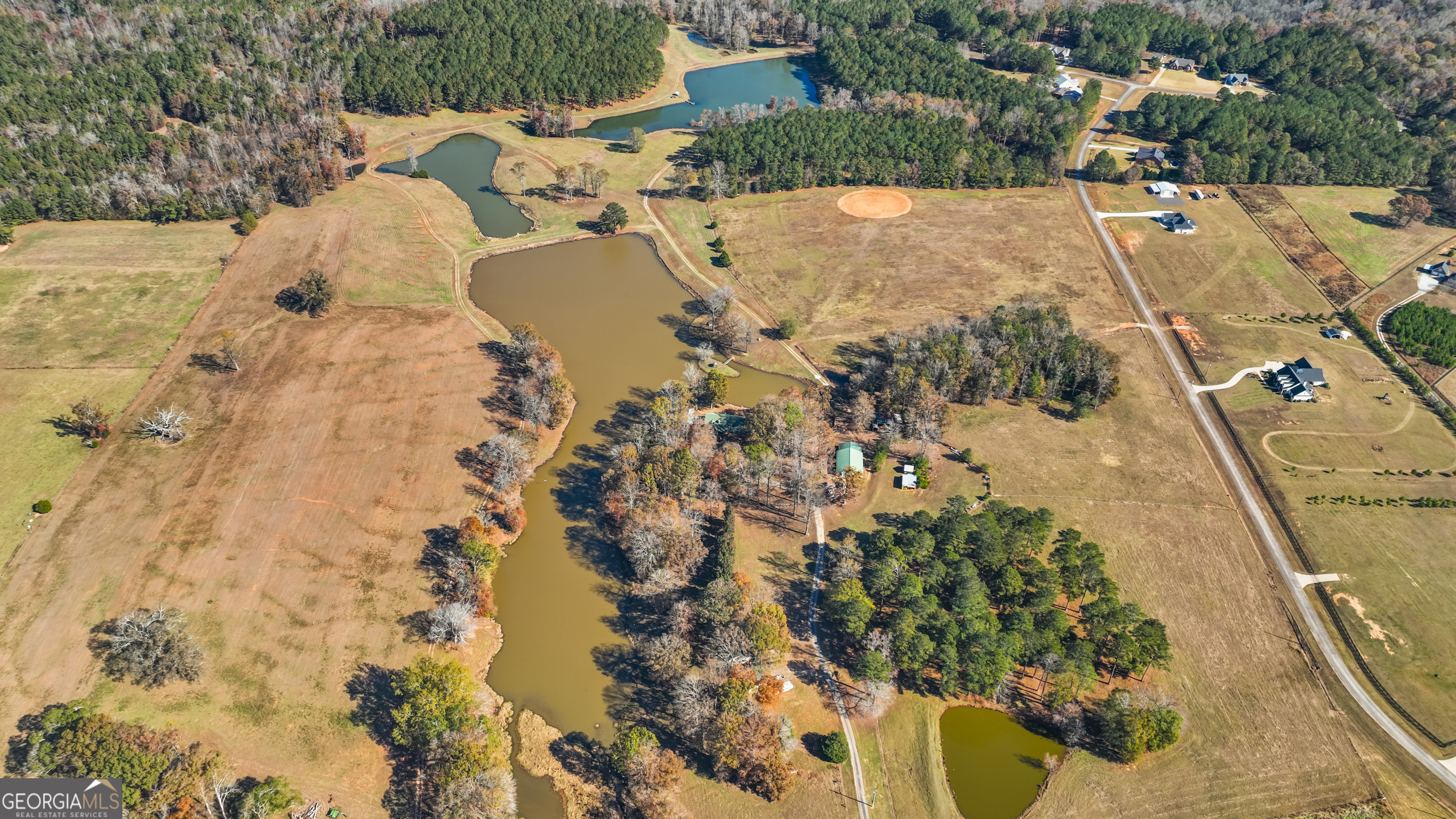 1390 Walker Road Madison, GA 30650 - Photo 7 of 64 an aerial view of a house with a yard