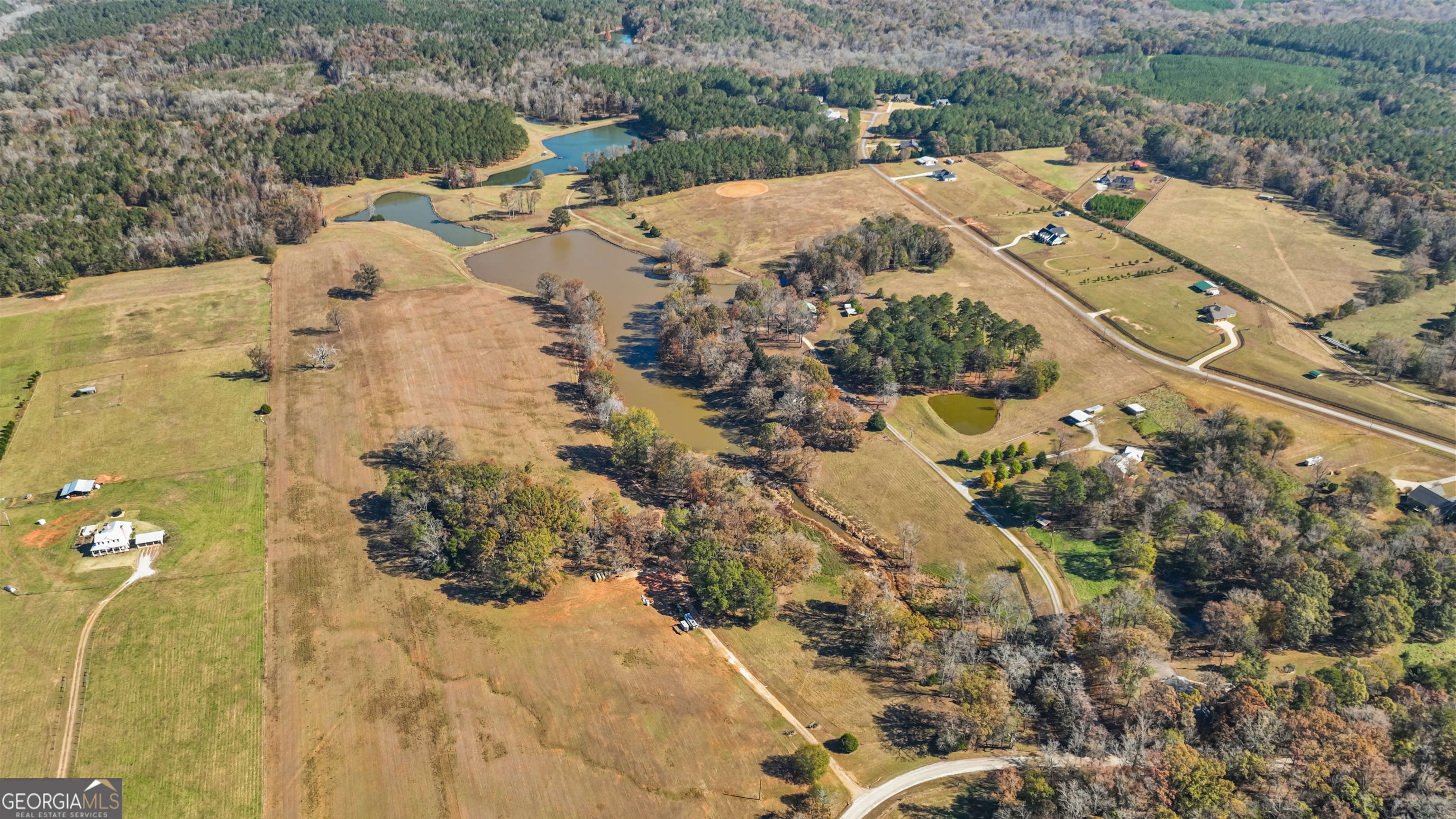 1390 Walker Road Madison, GA 30650 - Photo 8 of 64 an aerial view of a house with a yard and ocean view