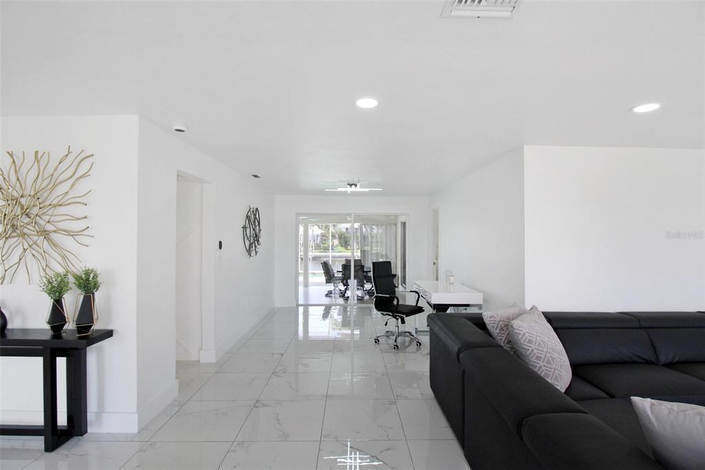 945 Bal Harbor Boulevard Punta Gorda, FL 33950 - Photo 14 of 71 a living room with furniture and potted plants