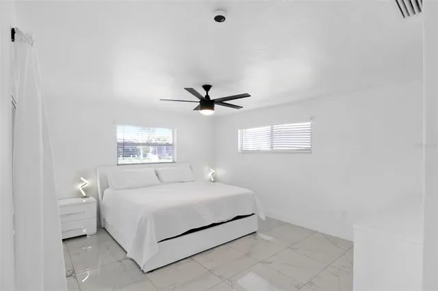 a bathroom with a toilet a sink a shower and mirror