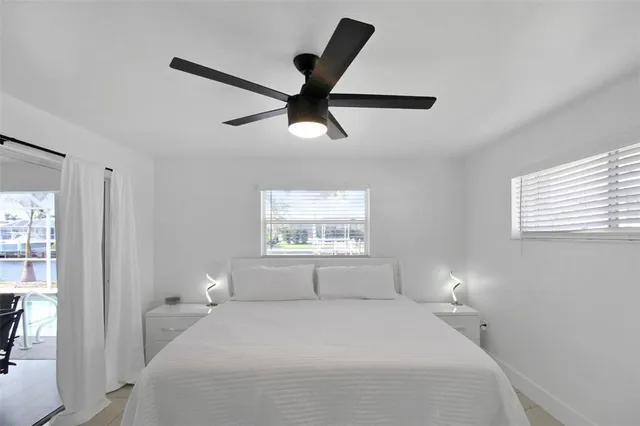 a bathroom with a shower and a window