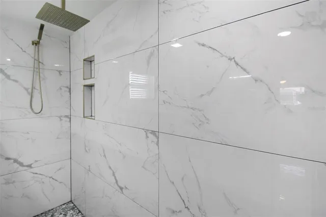 a kitchen with a sink refrigerator and cabinets