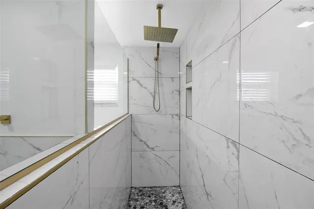 a view of a room with a floor to ceiling window and an outdoor space