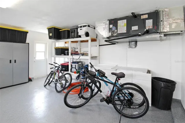 a view of a workspace room with furniture and potted plant