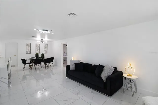a view of a livingroom with furniture and windows