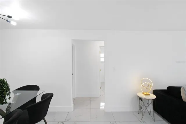 a view of a swimming pool with a bench in front of it