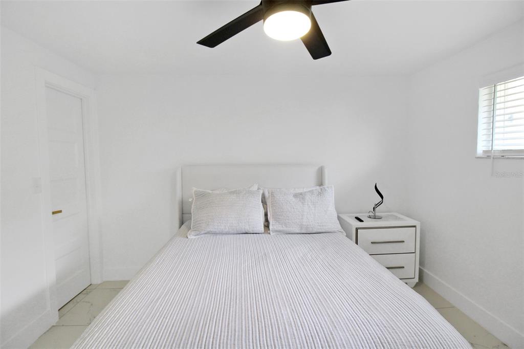 945 Bal Harbor Boulevard Punta Gorda, FL 33950 - Photo 48 of 71 a bedroom with a bed and white walls