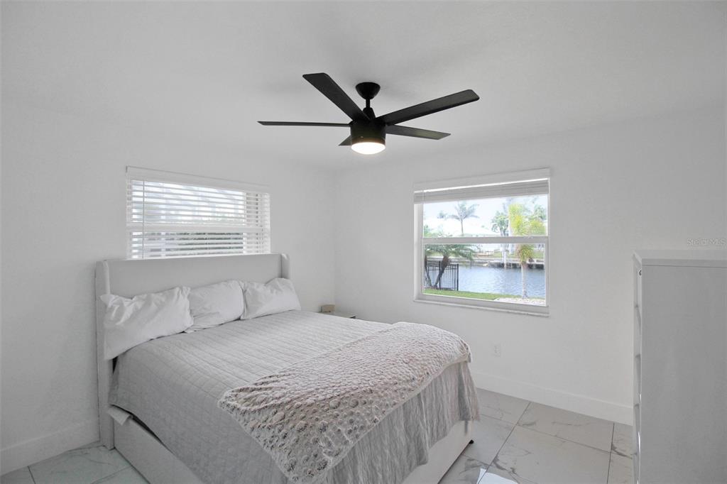 945 Bal Harbor Boulevard Punta Gorda, FL 33950 - Photo 54 of 71 a bedroom with a bed and a window