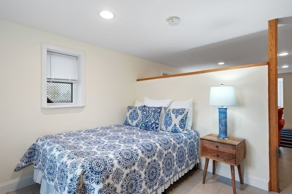 78 Southern Boulevard Newbury, MA 01951 - Photo 14 of 35 a bedroom with a bed and a lamp on table