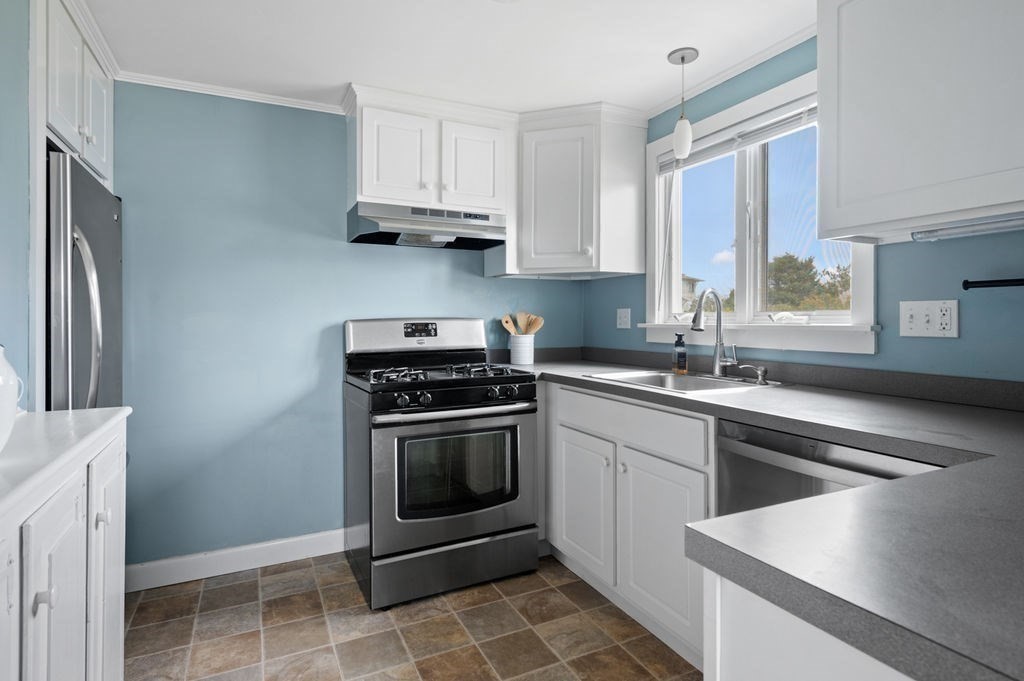 78 Southern Boulevard Newbury, MA 01951 - Photo 25 of 35 a kitchen with stainless steel appliances granite countertop a sink stove and refrigerator