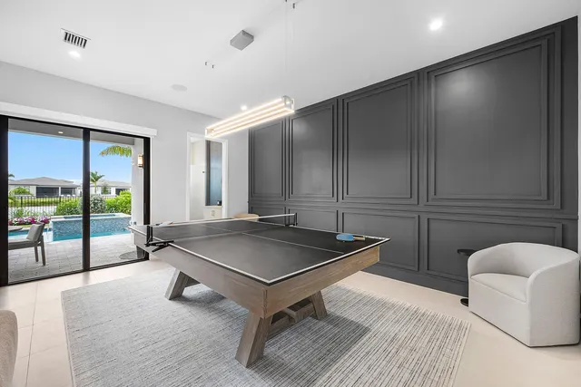 a bathroom with a granite countertop sink mirror vanity and toilet