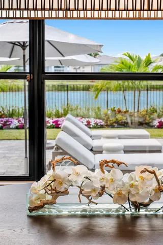 a view of staircase with railing and a window