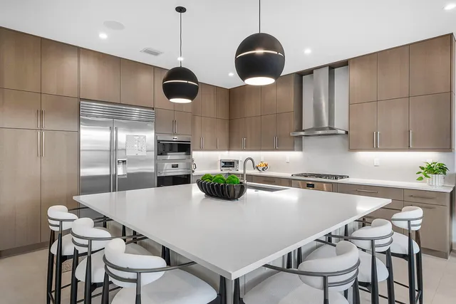 a living room with furniture a flat screen tv and a large window
