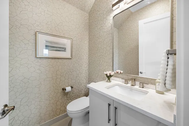 a bedroom with a large bed and a flat screen tv