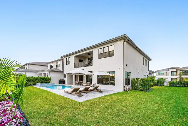 a bathroom with a sink toilet a mirror and shower