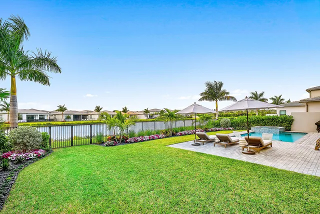 a bedroom with a large bed and a large window