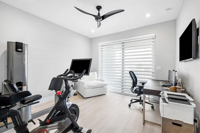 an aerial view of a house with a swimming pool yard and outdoor seating