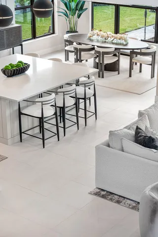 an aerial view of a house with a swimming pool