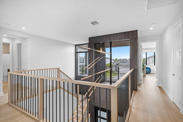 a front view of a house with a garden and yard