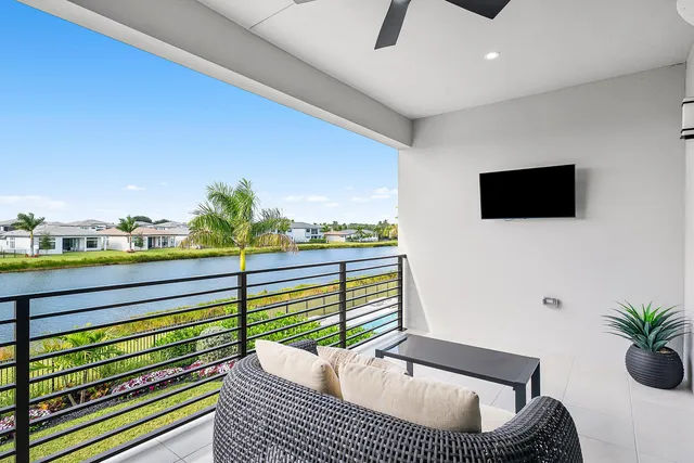 a living room with furniture pool table and a flat screen tv