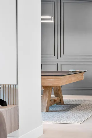 a kitchen with stainless steel appliances kitchen island granite countertop a sink a stove and a wooden floors