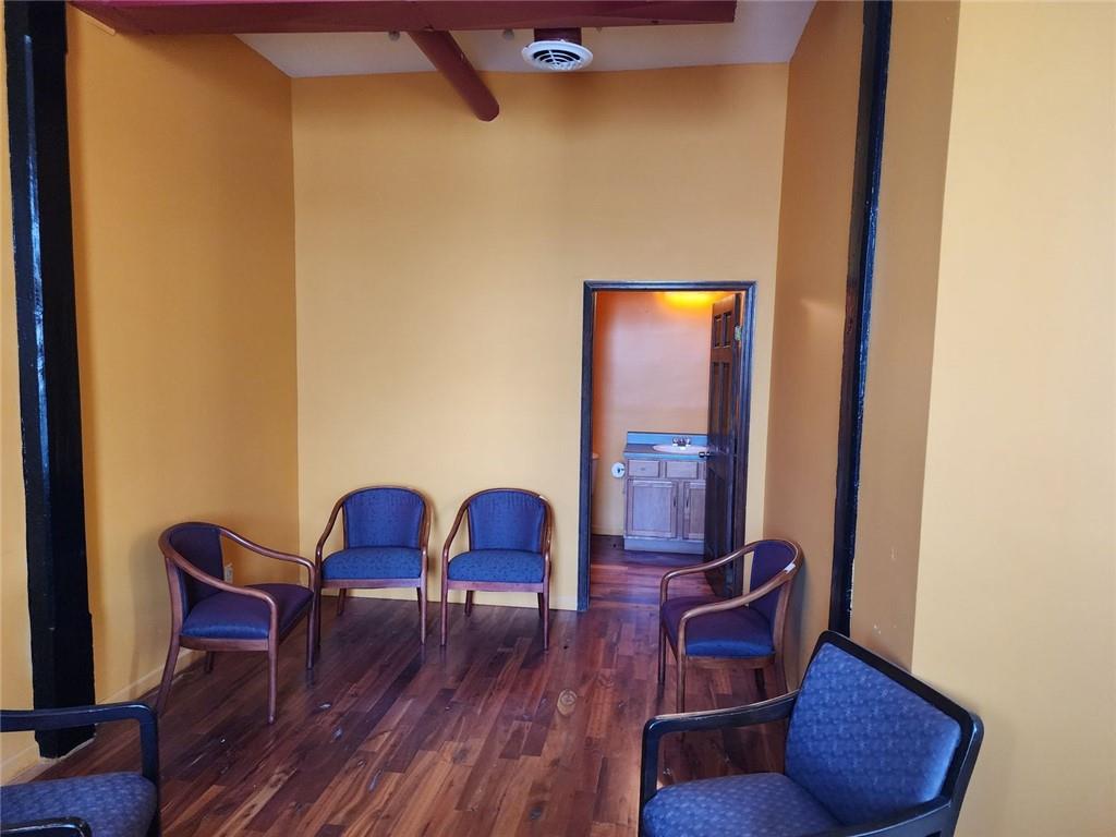 6958 Main Street Lithonia, GA 30058 - Photo 40 of 55 a view of a dining room with furniture and wooden floor