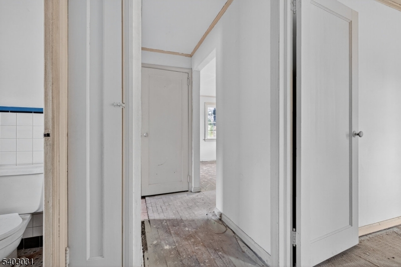 400 Douglas Road Roselle, NJ 07203 - Photo 12 of 16 a view of a bathroom from a hallway