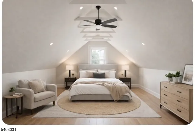 a spacious bedroom with a bed and a couch