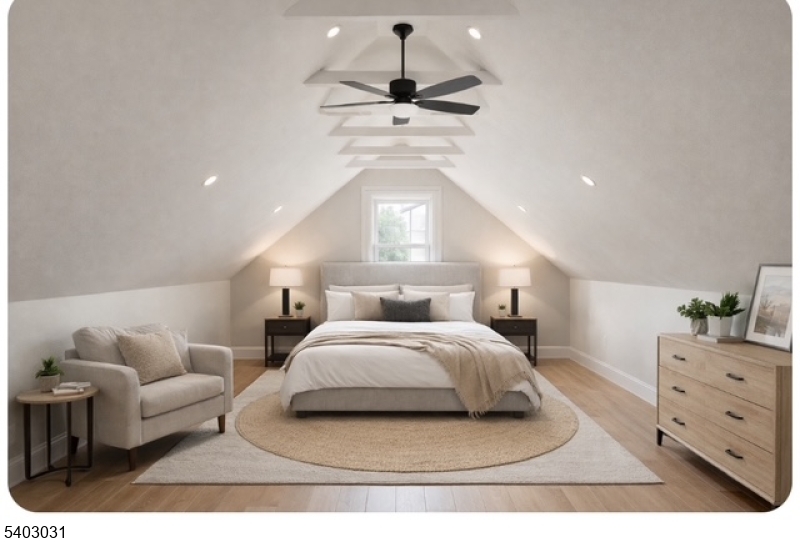 400 Douglas Road Roselle, NJ 07203 - Photo 15 of 16 a spacious bedroom with a bed and a couch