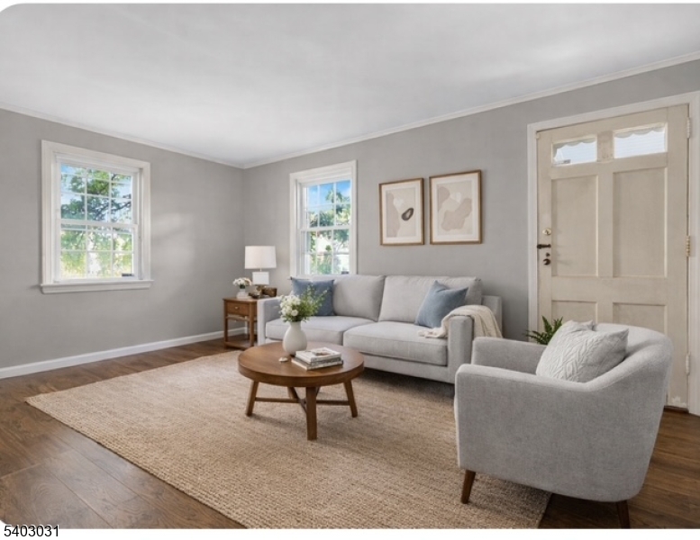 400 Douglas Road Roselle, NJ 07203 - Photo 7 of 16 a living room with furniture a rug and a window
