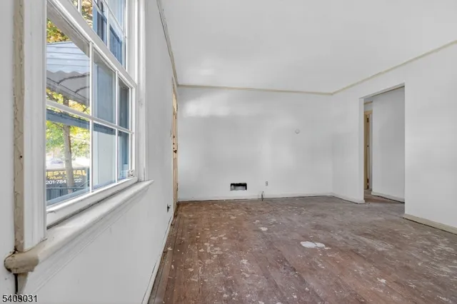 a view of an empty room with a window