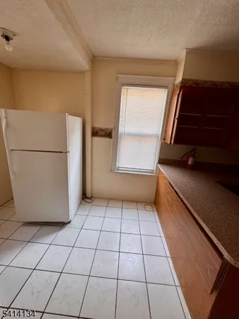 a kitchen that has a sink and a stove