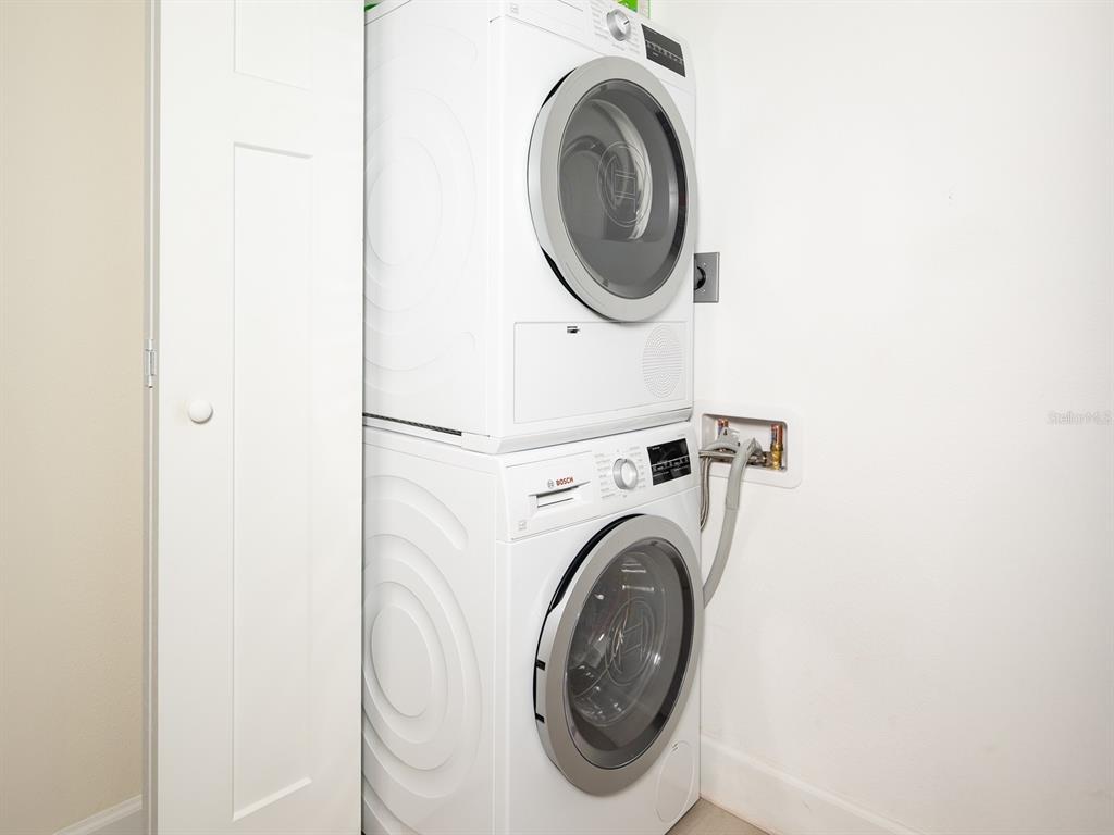 101 South Gulfstream Avenue, Unit 10E Sarasota, FL 34236 - Photo 13 of 54 a close up view of a washer and dryer