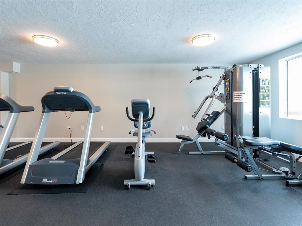 101 South Gulfstream Avenue, Unit 10E Sarasota, FL 34236 - Photo 34 of 54 a view of a room with gym equipment