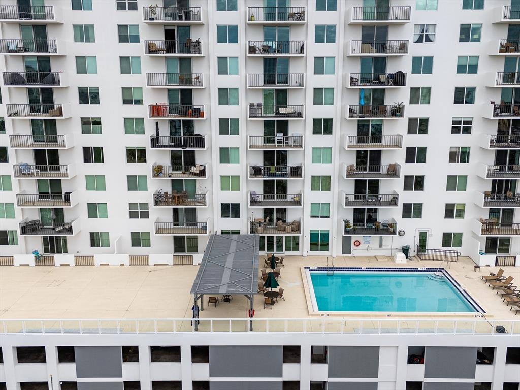 101 South Gulfstream Avenue, Unit 10E Sarasota, FL 34236 - Photo 39 of 54 a bathroom with a granite countertop sink and a black white checkered floor