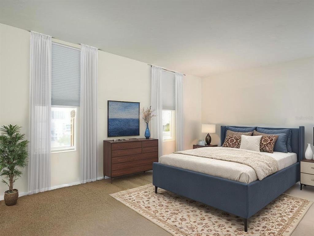 101 South Gulfstream Avenue, Unit 10E Sarasota, FL 34236 - Photo 9 of 54 a bedroom with a bed and a window