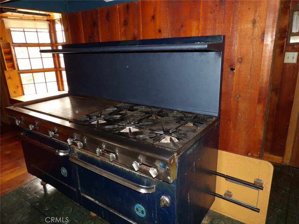 44001 Dunlap Road Miramonte, CA 93641 - Photo 18 of 75 a black and white stove top oven sitting inside of a kitchen
