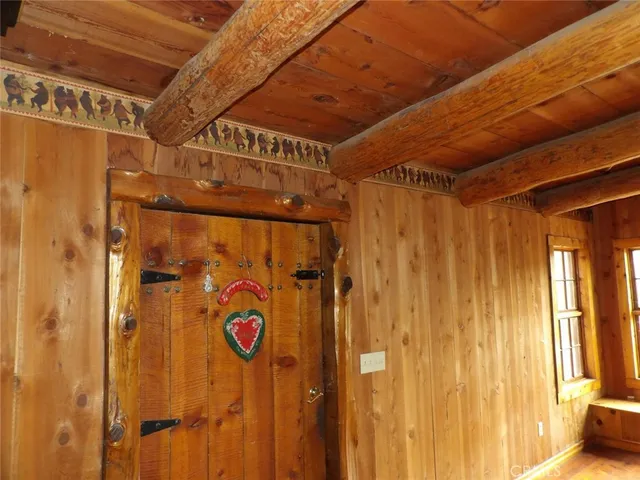 a kitchen with white cabinets and a refrigerator