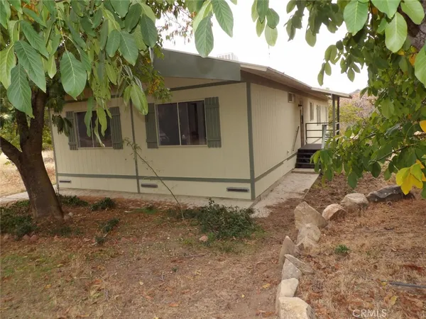 a bathroom with a shower a toilet and a sink