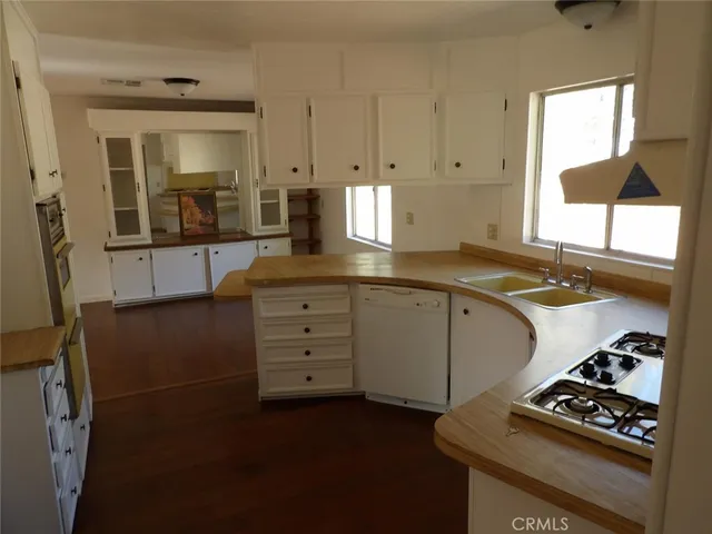 an aerial view of a house with yard