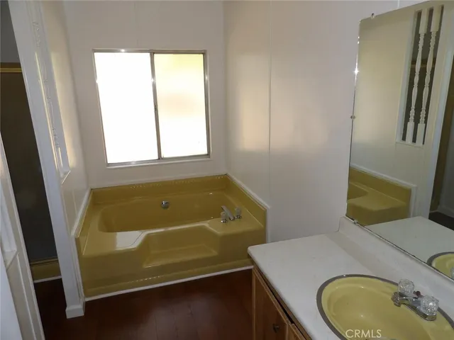 a kitchen with a sink and refrigerator