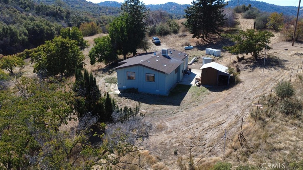44001 Dunlap Road Miramonte, CA 93641 - Photo 52 of 75 a aerial view of a house with a yard and large trees