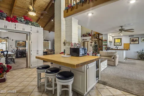 a kitchen with a sink a counter top space and a large window